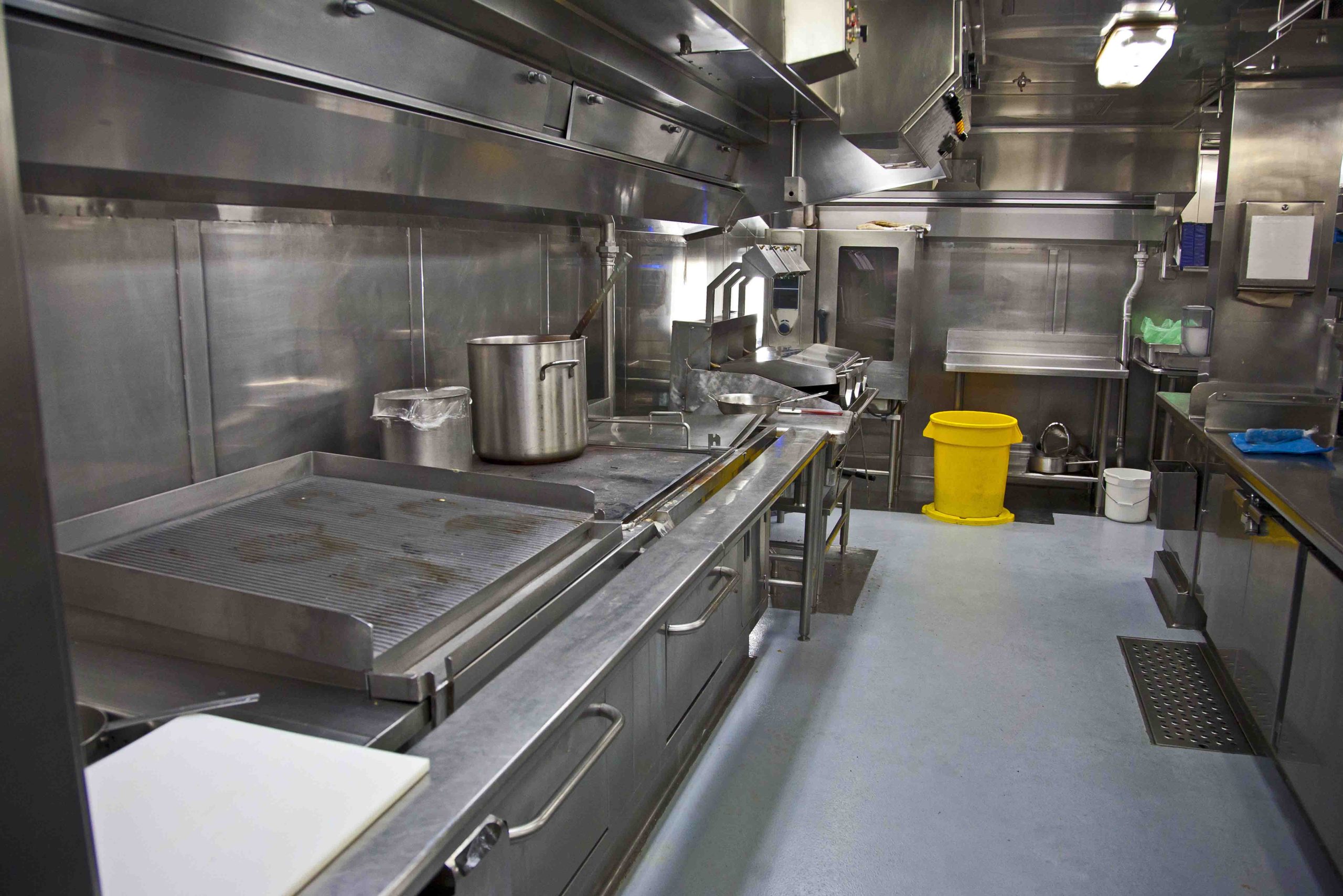 stainless steel surfaces and grills in an industrial sized kitchen